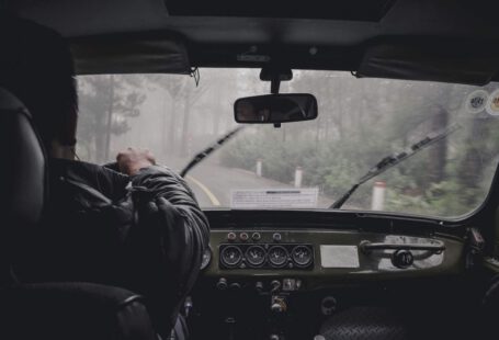 Drive License - man driving car during rainy daytime