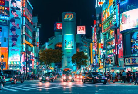 Japan - people gathered outside buildings and vehicles