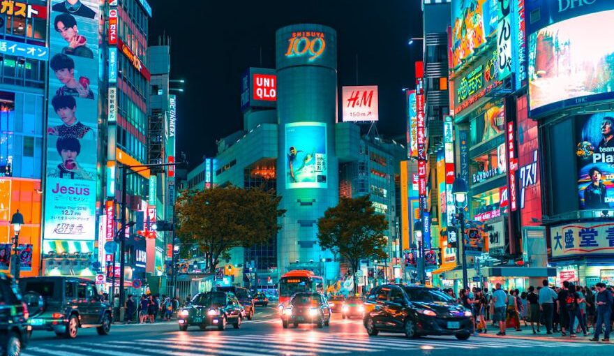 Japan - people gathered outside buildings and vehicles