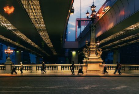 Japanese Summer - a group of people walking across a bridge