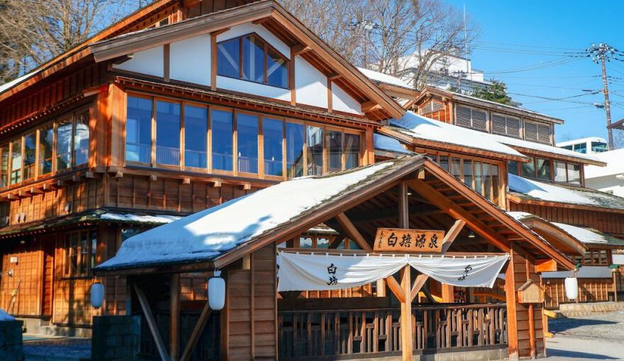 Japanese Onsen - brown wooden house near trees during daytime