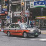 Japanese Taxis - red and grey car on road