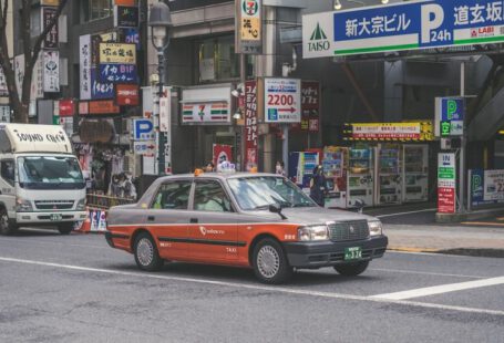 Japanese Taxis - red and grey car on road