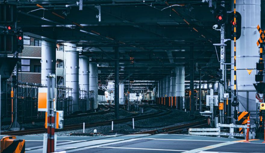 Japanese Railroad - a train station with a train on the tracks