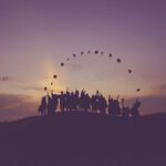 Japanese Education - silhouette of people standing on hill