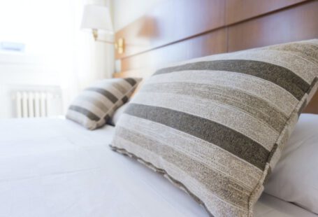 Capsule Hotel Japan - gray and black throw pillow on bed