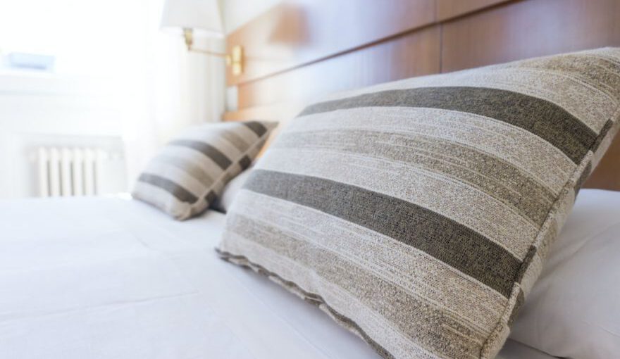 Capsule Hotel Japan - gray and black throw pillow on bed