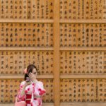 Japanese Traditions - girl in pink and white floral dress covering her face with her hands