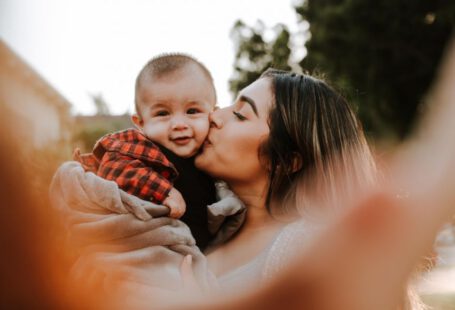 Love Hotels Japan - woman kiss a baby while taking picture