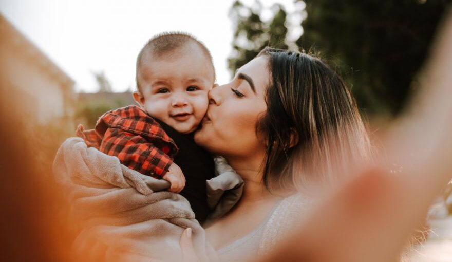 Love Hotels Japan - woman kiss a baby while taking picture