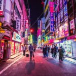 Shopping Japan - people walking between city building