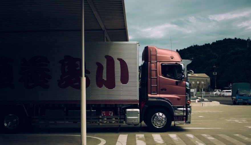 Japanese Companies - box truck passing through toll gate