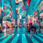 Tokyo - people walking on road near well-lit buildings