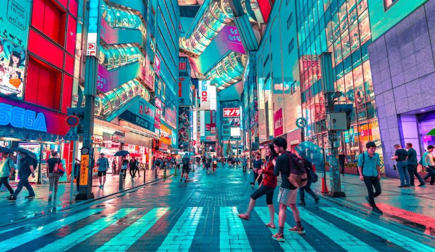 Tokyo - people walking on road near well-lit buildings