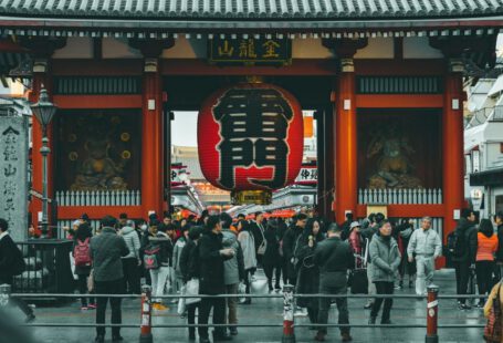 Japanese Society - people standing on concrete castle at daytime