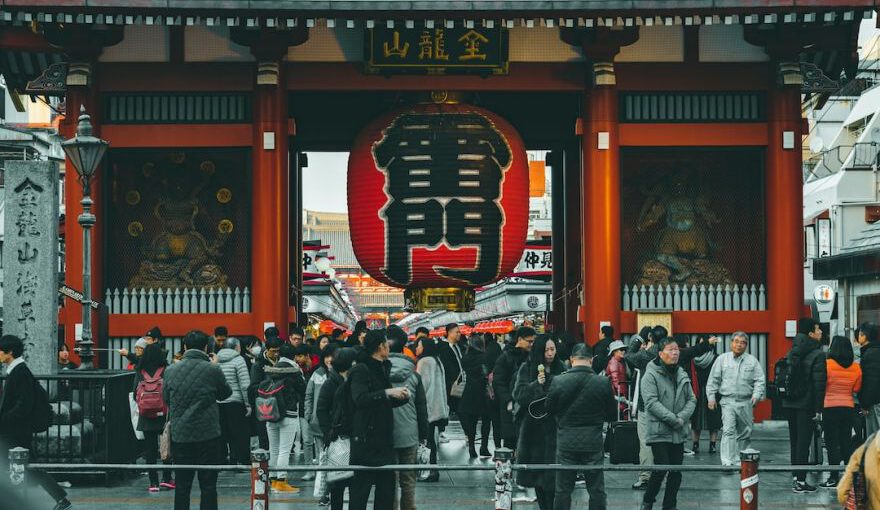 Japanese Society - people standing on concrete castle at daytime