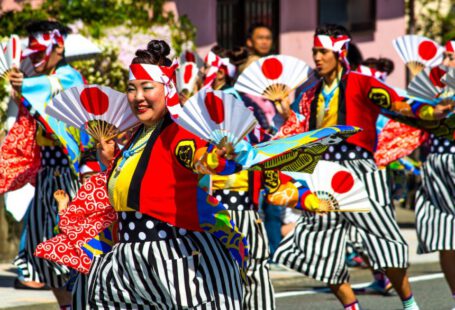 Japan Festival - people in red and black traditional dress standing on street during daytime