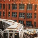 Japanese Railroad - Photo of Train in Railway Track Near Buildings