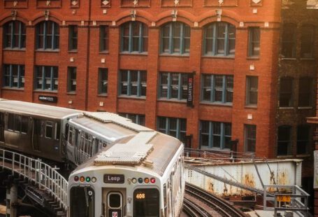 Japanese Railroad - Photo of Train in Railway Track Near Buildings