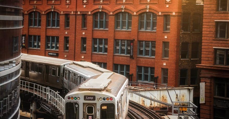 Japanese Railroad - Photo of Train in Railway Track Near Buildings