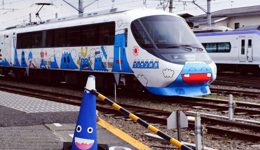 Japanese Train - white and blue train on rail tracks