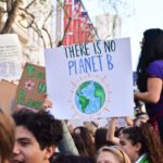 Climate - person holding there is no planet b poster