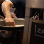 Japanese Omiyage - a man putting rice into a large pot