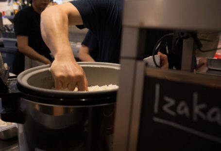 Japanese Omiyage - a man putting rice into a large pot