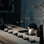 Japanese Tea Ceremony - white flowers on black ceramic vase