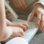 Gift-giving Japan - persons hand on white laptop computer