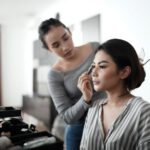 Japanese Cosmetics - woman in gray cardigan holding her face