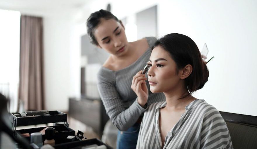 Japanese Cosmetics - woman in gray cardigan holding her face