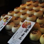 Japanese Snacks - white and brown pastry on display counter