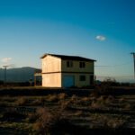 Power Outlets - low-angle photography of house beside street