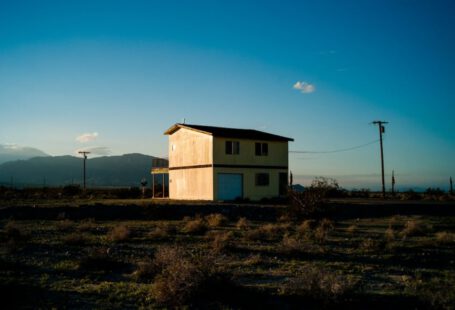 Power Outlets - low-angle photography of house beside street