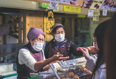 Japanese Masks - two vendors accommodating customer