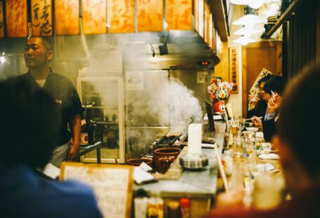 Sushi In Japan - man stainding near wall