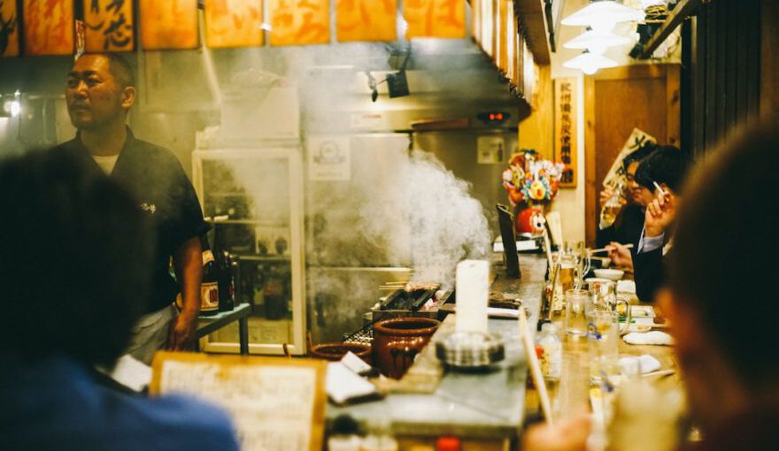 Sushi In Japan - man stainding near wall